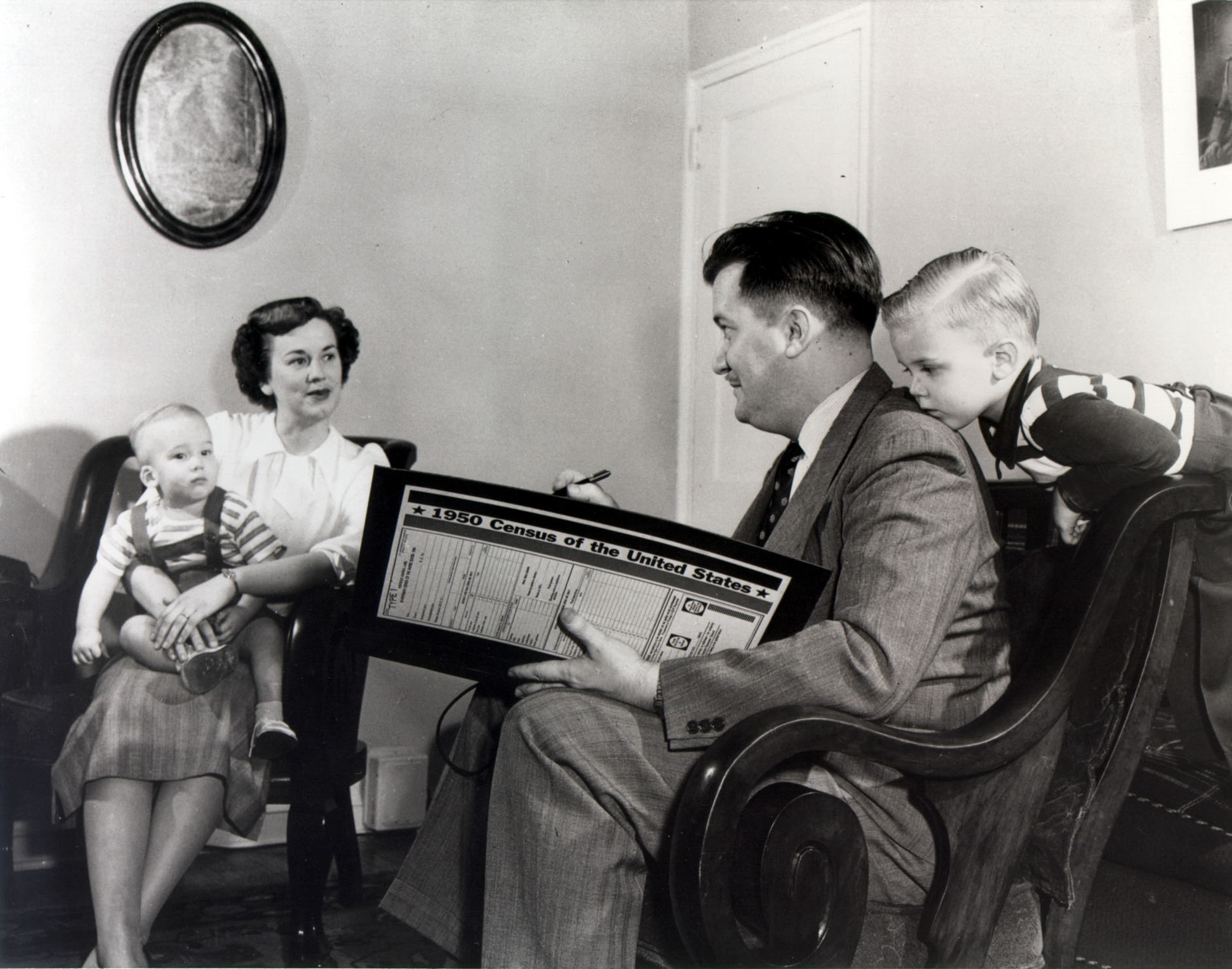 Census enumerator in 1950 interviewing a family